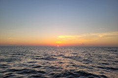 Ocean sunrise in the distance